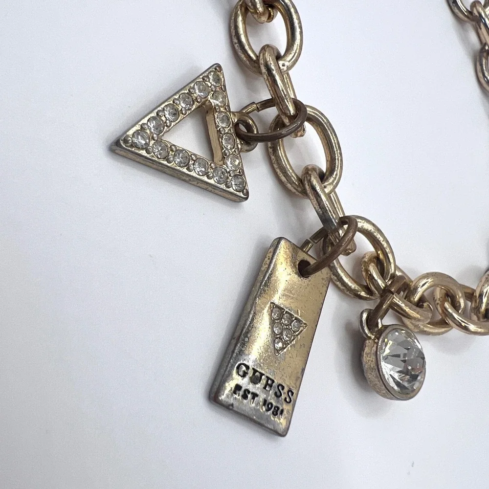 GUESS Vintage Gold Tone Charm Bracelet Rhinestone Logo Est 1981 Y2K Signed